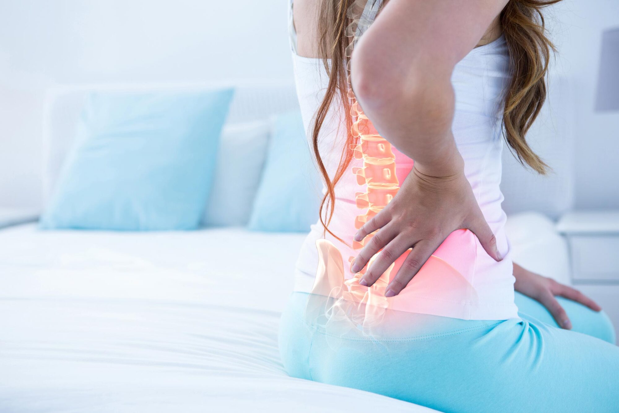 Digital composite of highlighted spine of woman with back pain at home